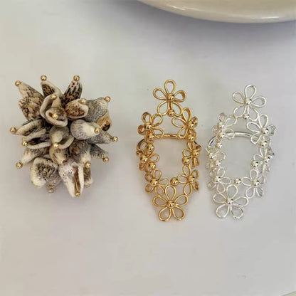 Korean-style Hollow-out Floral Lace Ring with Movable Shell Pendant