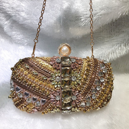 MRY · Coffee gold dinner bag in hand