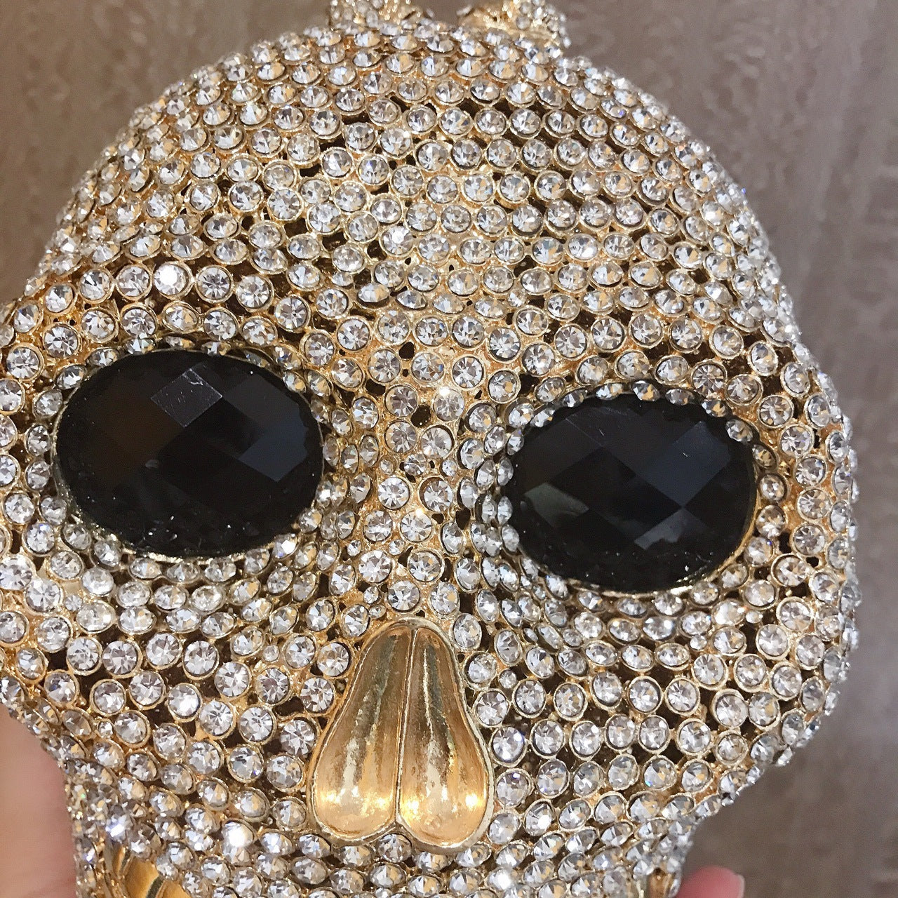 MRY · Diamond-encrusted skull dinner bag