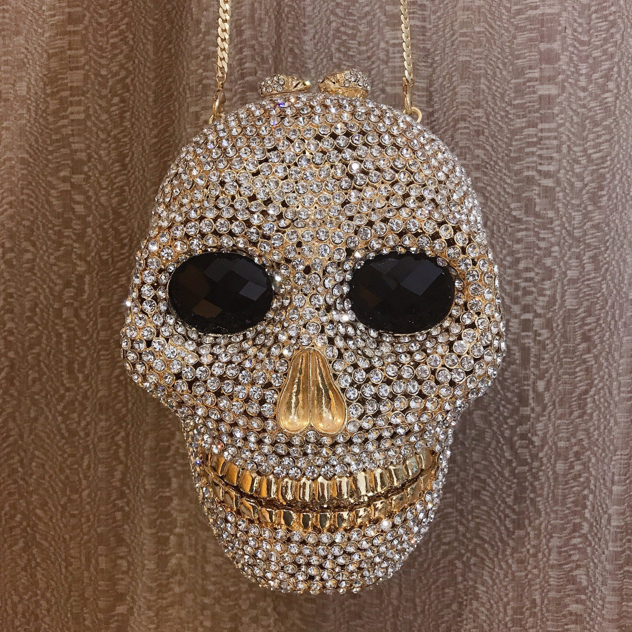 MRY · Diamond-encrusted skull dinner bag