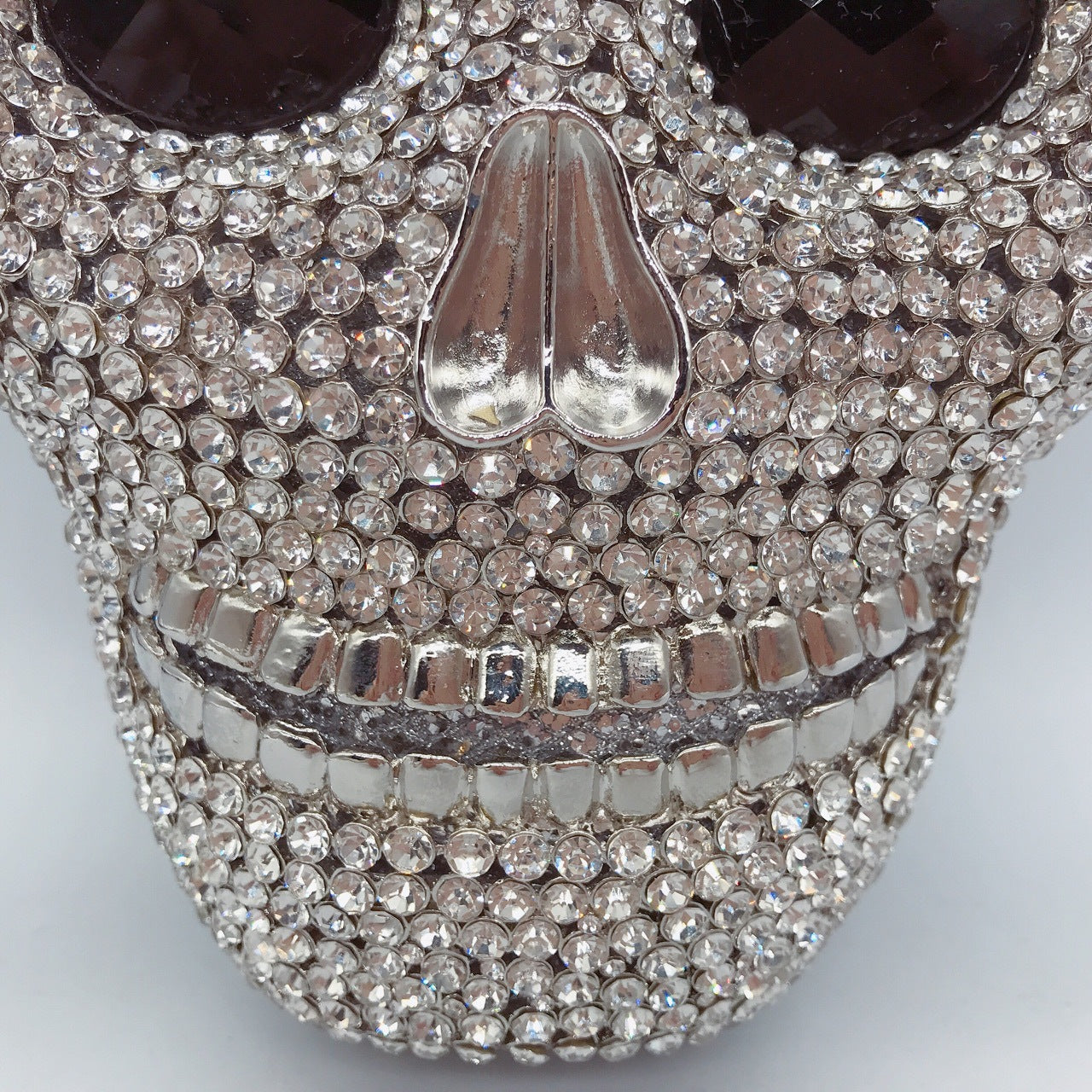MRY · Diamond-encrusted skull dinner bag