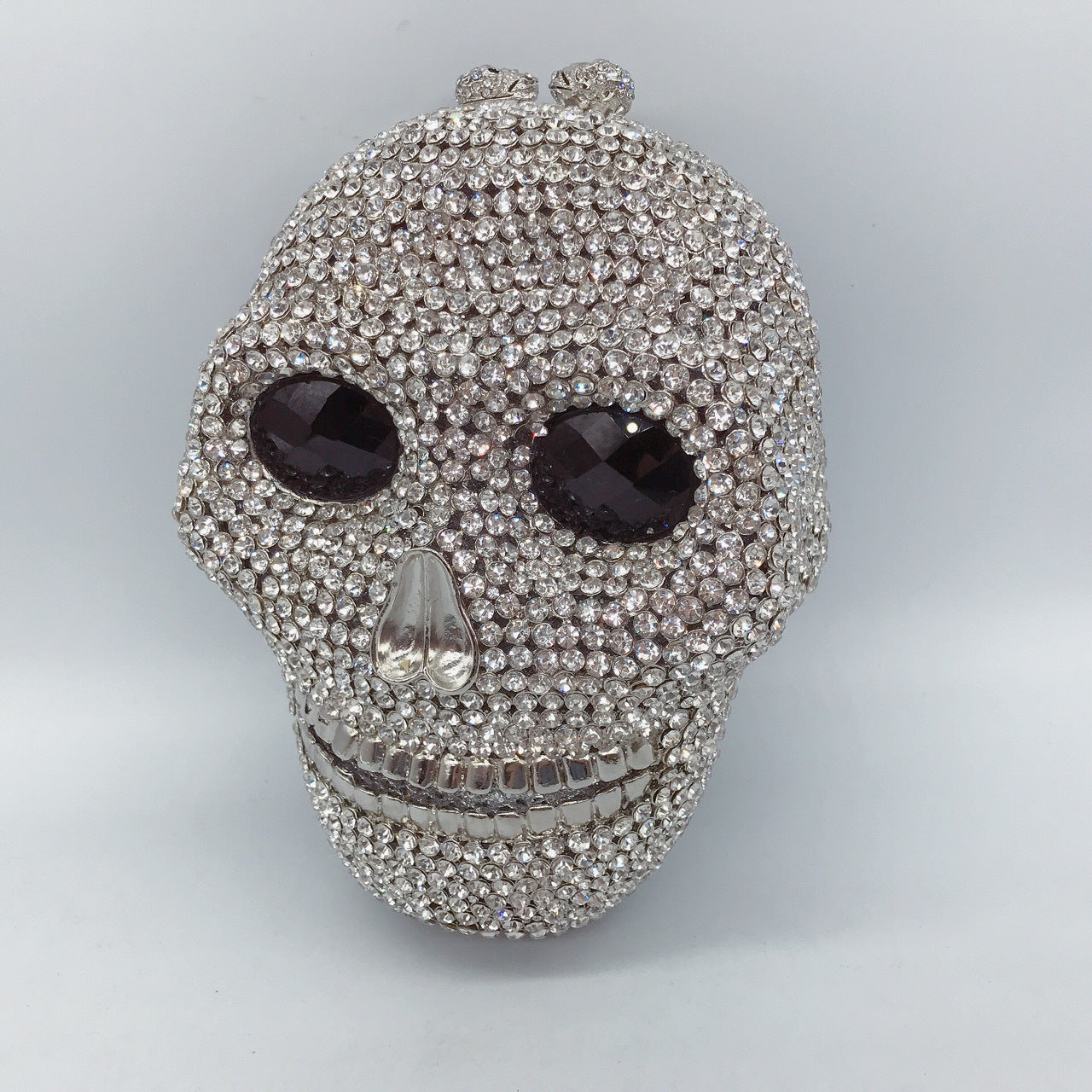 MRY · Diamond-encrusted skull dinner bag