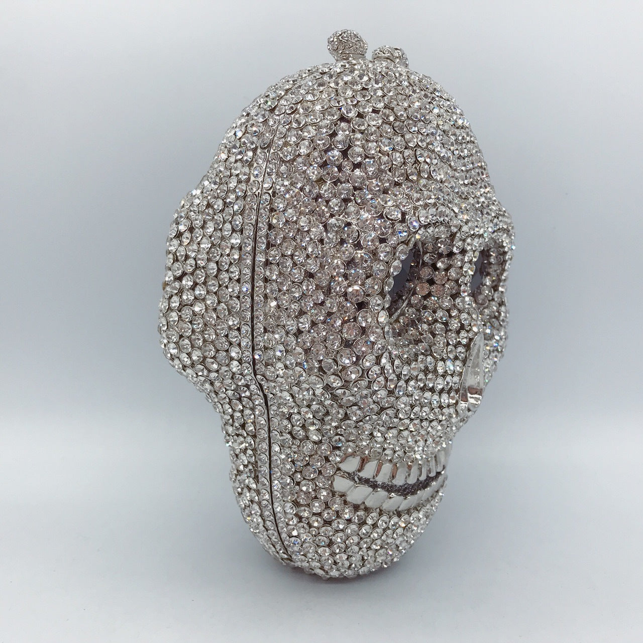 MRY · Diamond-encrusted skull dinner bag