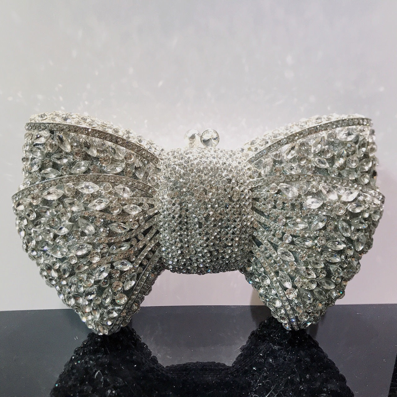 MRY · Diamond-encrusted bow dinner bag